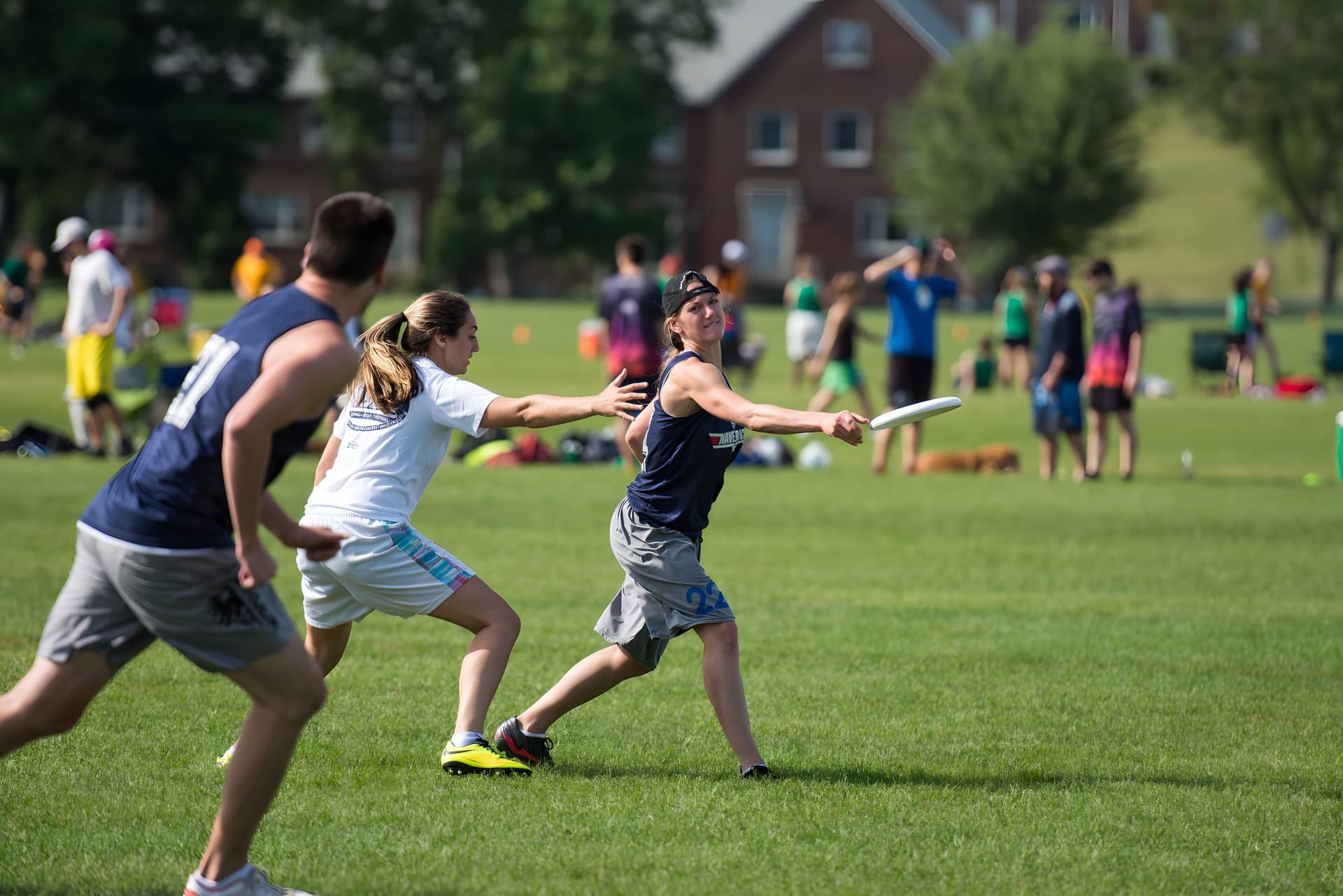 A summer-league point in Boston — thrower releasing a forehand around the mark
