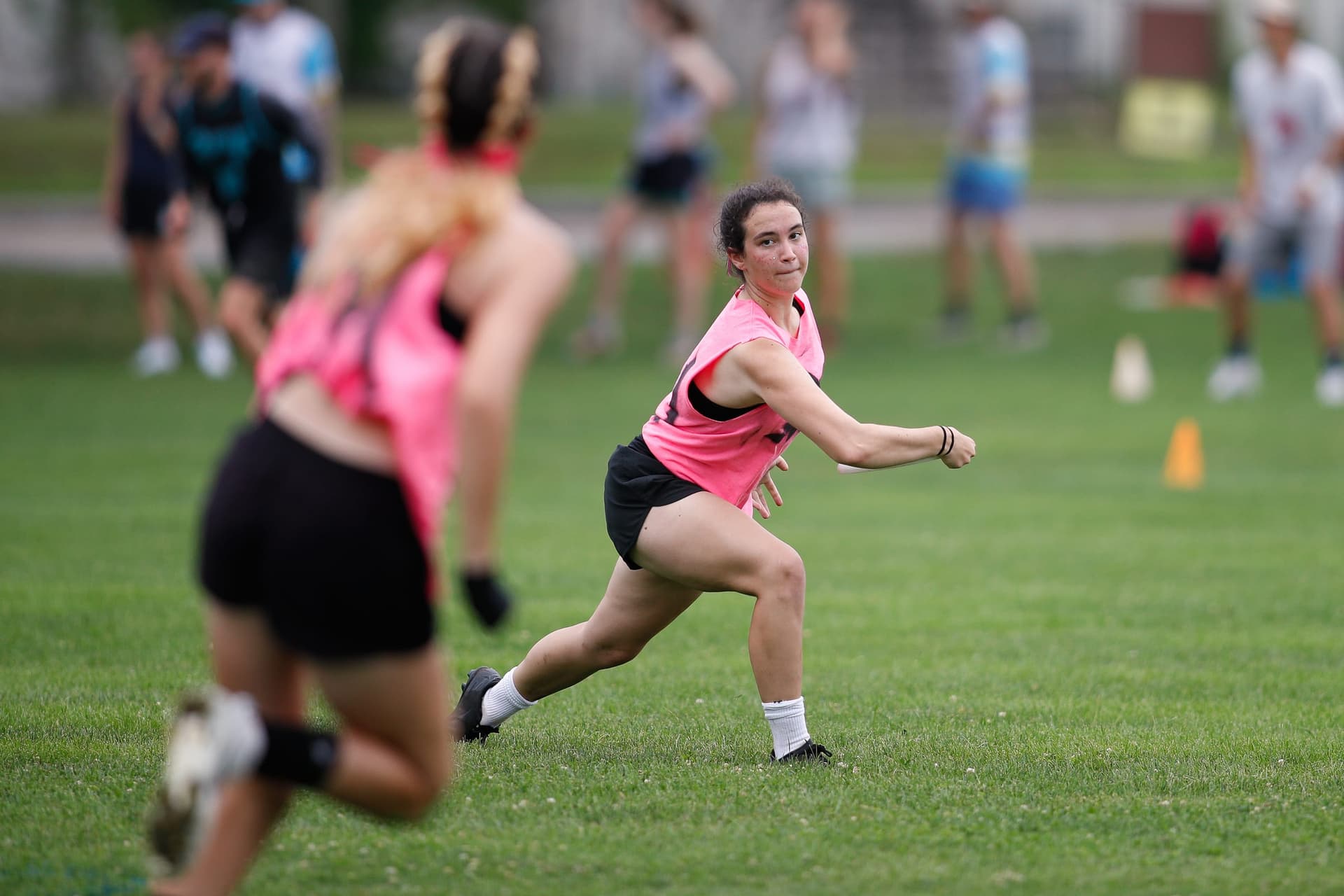 A cutter mid-stride looking back for the disc at Boston Invite